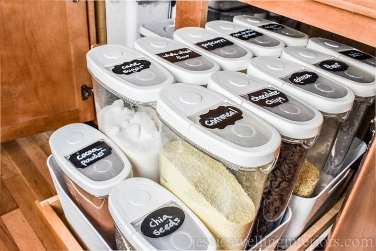 image of cabinet with slide-out drawer and organized baking ingredients