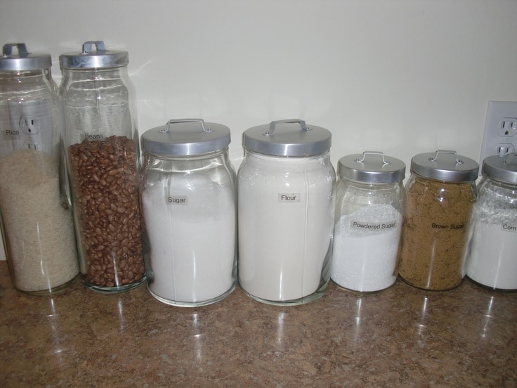 Baking supplies labeled in glass jars