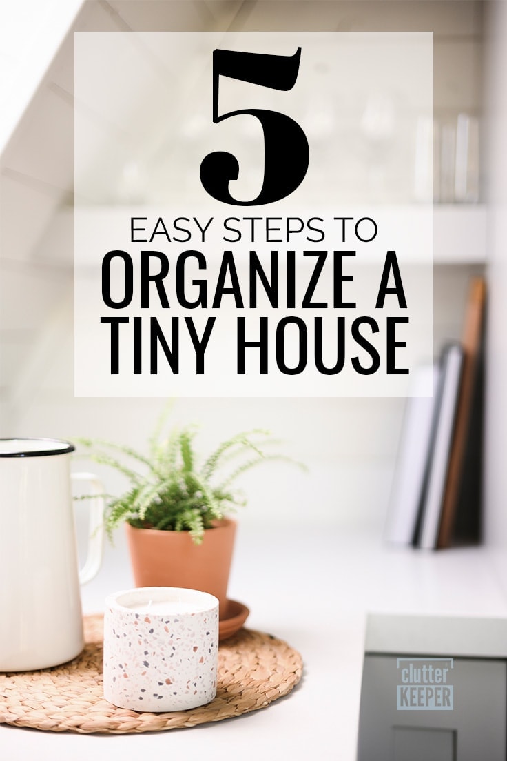 5 Easy Steps to Organize a Tiny House, a candle and a plant on a wicker placemat on a counter