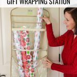 How to Make a Christmas Gift Wrapping Station, a woman sliding wrapping paper rolls out of a Clutter Keeper® hanging gift bag storage organizer