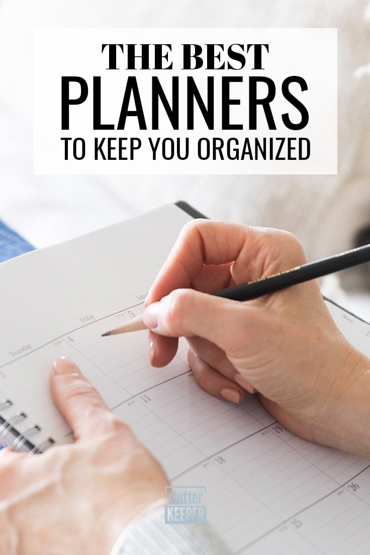 The best planners to keep you organized, close up of a woman's hands holding a pencil and writing on a paper calendar.