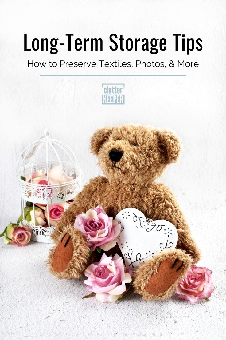 Teddy bear and dried roses with a text overlay that reads 